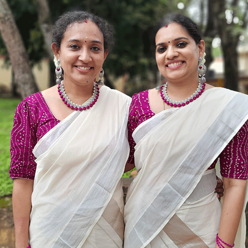 chandani with her friend on onam celebration with silk thread purple  necklace and matching earrings set