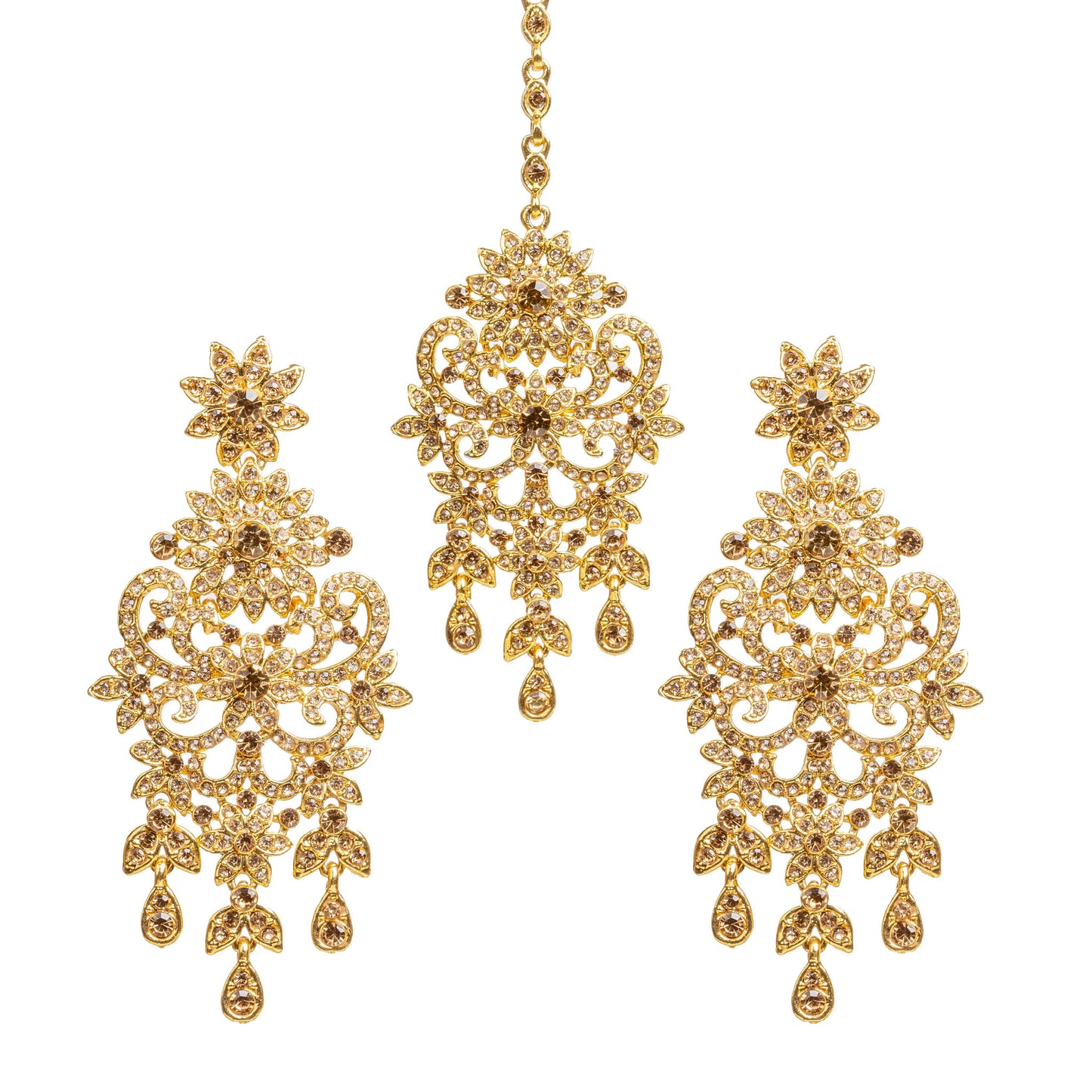 Bindhani gold-plated earrings and maang tikka set embellished with champagne-colored LCT stones and sparkling crystal accents. The earrings feature a floral stud, intricate openwork filigree design with floral and scrollwork detailing, a central stone motif, and three dangling teardrop-shaped LCT stone drops. The matching maang tikka showcases a coordinating floral design with detailed openwork, a central stone motif, and three dangling teardrop-shaped LCT stone drops. Front view displayed on a white backgr