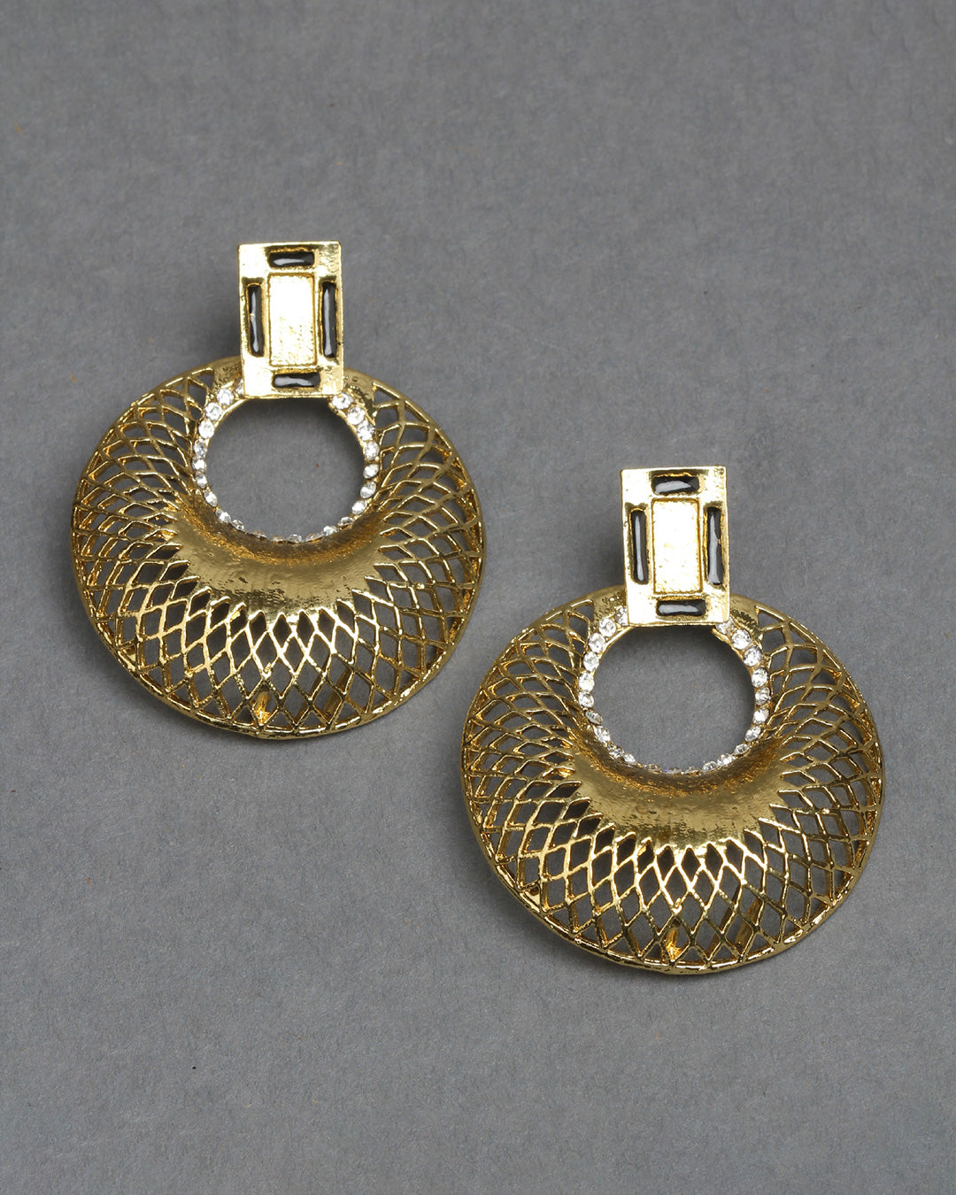 Bindhani gold-plated geometric earrings featuring a rectangular textured stud top with a circular open hoop design. The large round hoops showcase intricate lattice-style cutwork with a polished gold finish and small white stone detailing around the inner ring. Modern statement earrings displayed as a pair on a dark grey background.