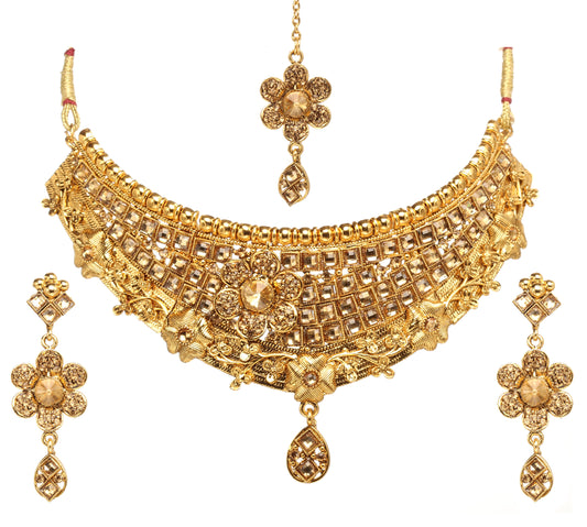 Bindhani gold-plated handcrafted bridal choker necklace set featuring an intricate lattice pattern with floral motifs and textured detailing. The statement choker has a central flower design, decorative bead border, and a teardrop-shaped dangling pendant. The set includes matching floral drop earrings with geometric tops and a coordinating floral maang tikka. Front view displayed on a white background.