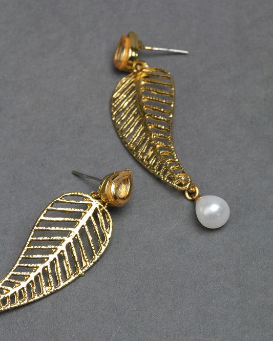 Bindhani gold-plated kundan stud earrings featuring a small teardrop-shaped stud adorned with white kundan stone detailing. The elegant stud top is connected to a leaf-inspired drop design with intricate openwork gold patterns and a white pearl hanging for a traditional and graceful look.