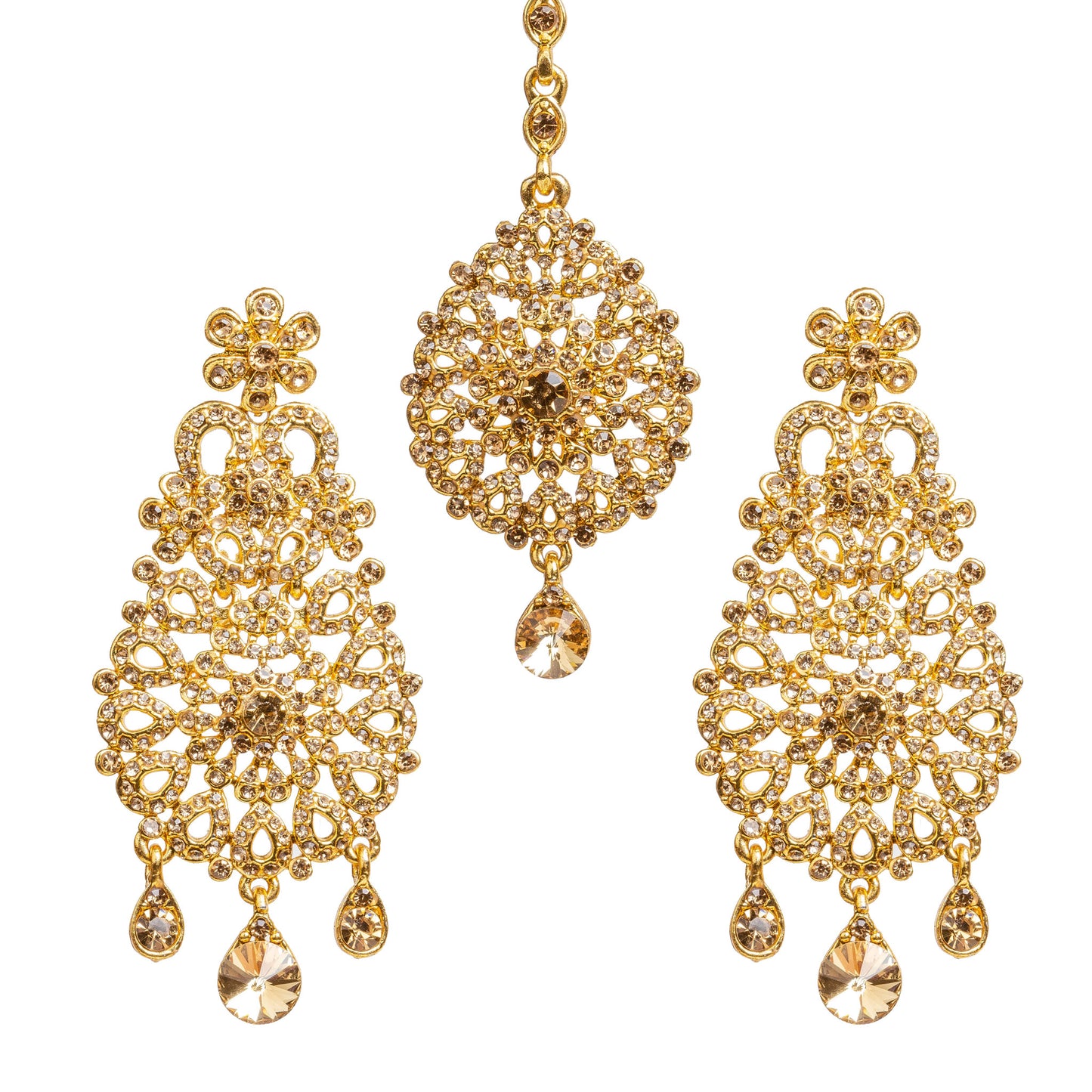 Bindhani golden-plated earrings and maang tikka set embellished with champagne-colored LCT stones and sparkling crystal accents. The earrings feature a floral stud, intricate openwork filigree design with a central floral motif, and three dangling teardrop-shaped LCT stones. The matching maang tikka showcases a round floral design with a central champagne LCT stone and one dangling teardrop-shaped LCT stone. Front view displayed on a white background.