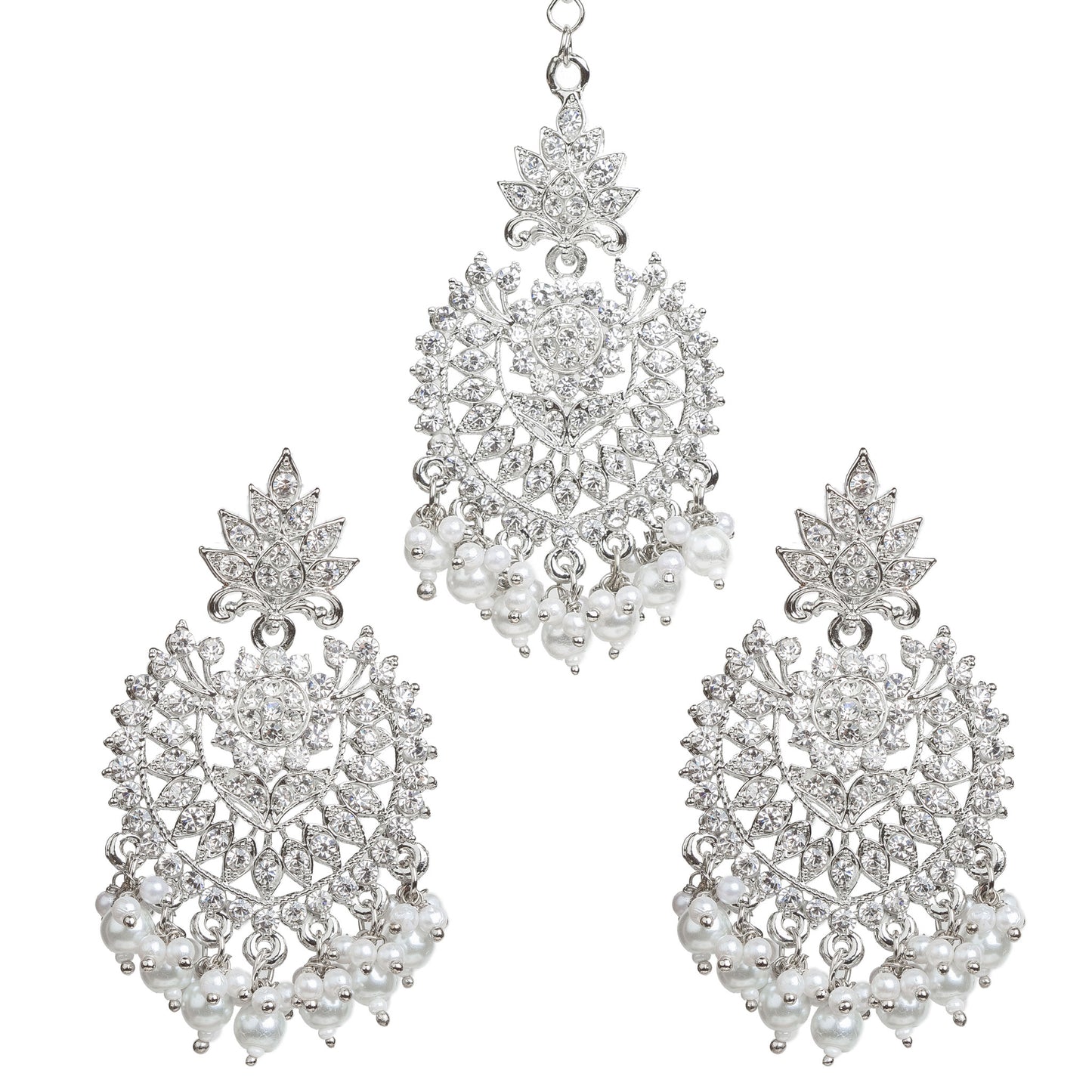 Bindhani silver-plated jewelry set featuring a matching maang tikka and statement earrings. The earrings showcase a leaf-shaped stud top, intricate openwork floral and geometric design embellished with clear stones, a central round stone, and white pearl bead tassels. The coordinating maang tikka features the same leaf and floral motif with dangling white pearl bead clusters. Front view displayed on a white background.