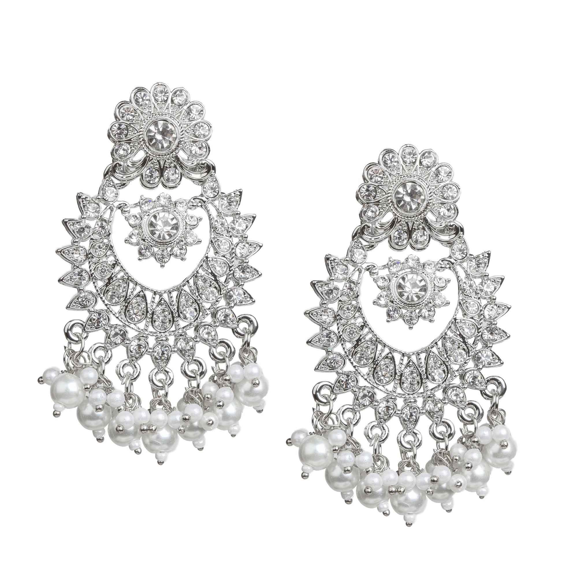 Bindhani silver-plated chandbali earrings featuring intricate floral and crescent-shaped designs adorned with clear stones. The earrings have a floral stud top, an ornate floral centerpiece, detailed openwork, and white pearl bead tassels along the bottom edge. Front view displayed on a white background.