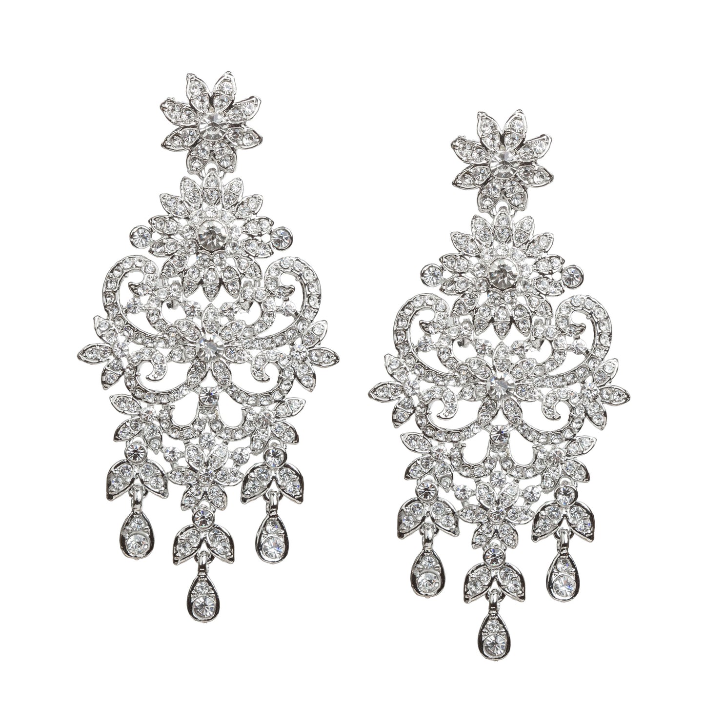 Bindhani silver-toned statement earrings featuring clear stones with sparkling crystal accents. Each earring showcases a floral top, intricate leaf and scrollwork detailing, a detailed central floral motif, and three dangling teardrop-shaped clear stone drops. Front view displayed on a white background.