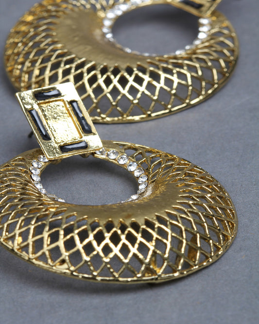 Close-up zoom view of Bindhani gold-plated geometric earrings, highlighting the intricate lattice cutwork pattern on the circular hoop, textured gold finish, rectangular stud top, and delicate white stone detailing around the inner ring. The detailed craftsmanship and polished traditional design are clearly visible.